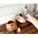 This image shows me holding the elf hat. The inside of the Christmas gourd is unfinished as a reminder that it is not made from plastic.